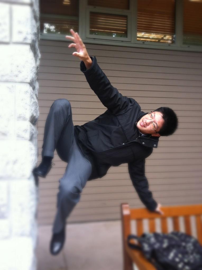 Grade 12 student Colin Wang “parkours” up the wall near the School’s entrance. 