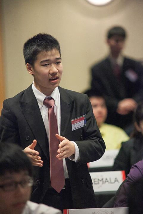 Kenneth Huang arguing his points at a conference.