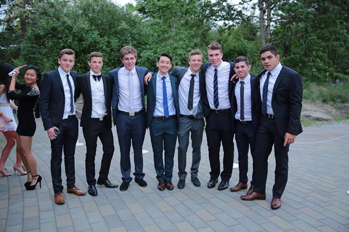 Sharply dressed, a few of the boys line up to take a picture.