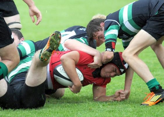 St. George's Winston Jin hangs on to the ball vs. Oak Bay.