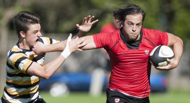 St. George's Mitchell Rothman tries to fend off a Prince of Wales defender