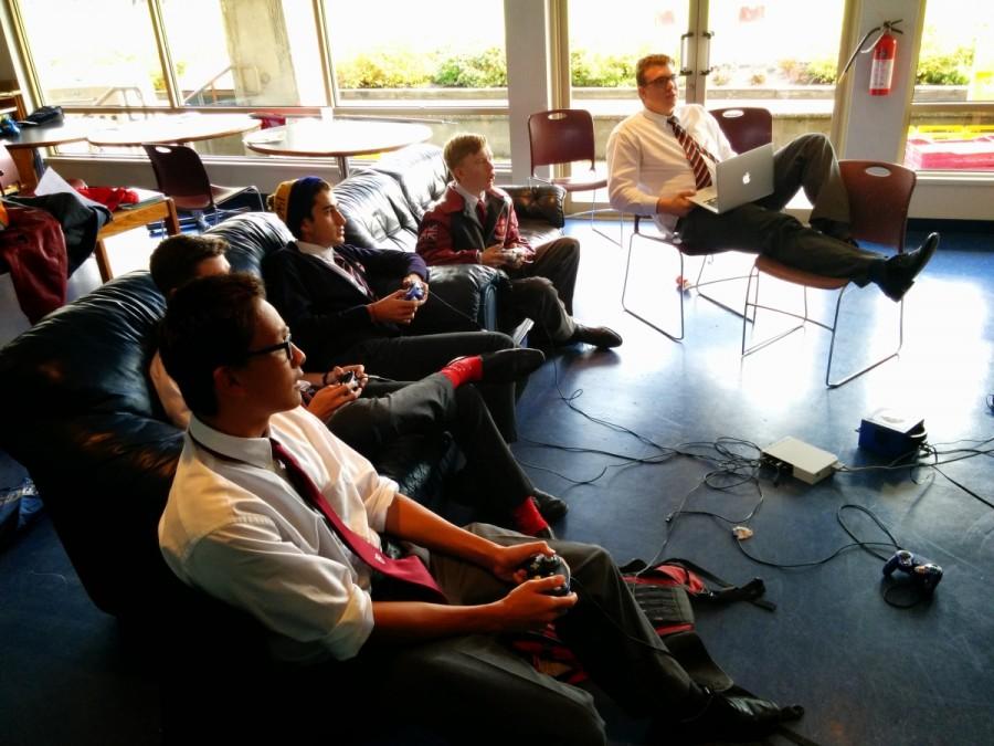 Grade twelve students Matthew Lee, Reed Smith, Dugald Lamb, and Joe Sourisseau enjoy some Super Smash Bros. action in the Grad Lounge.