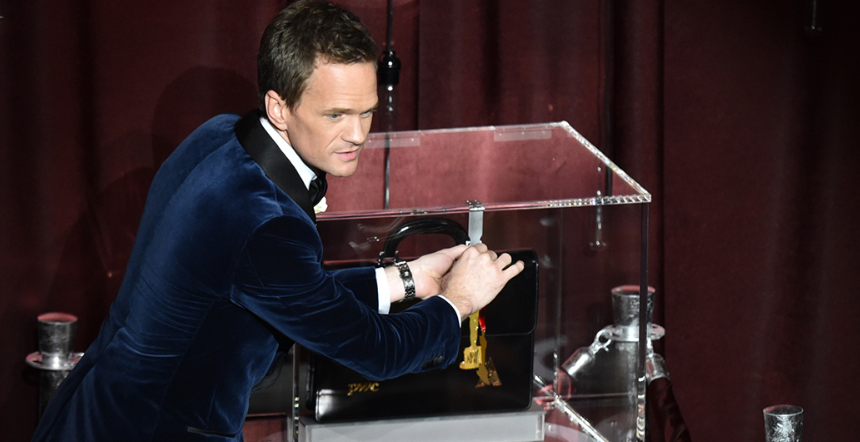 Neil Patrick Harris with his tightly secured Oscar predictions.