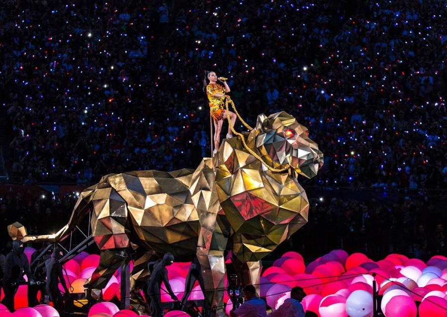 Katy Perry singing on a mechanical tiger.