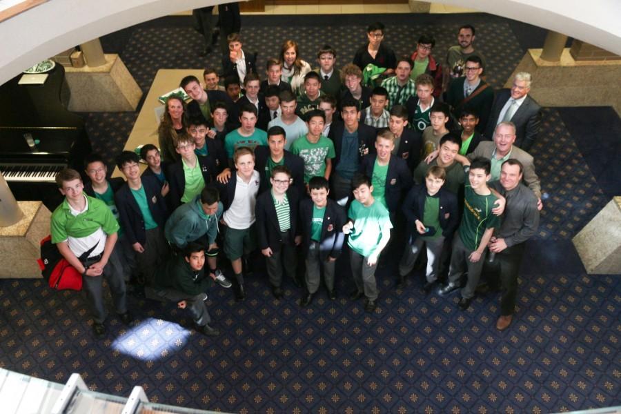 Students wearing green shirts. 