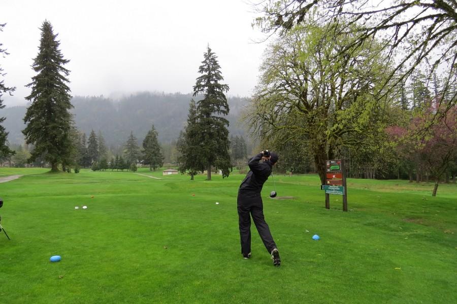 Andy Fan (Gr. 8) hitting his tee shot on the first hole of the Alberni Golf Course