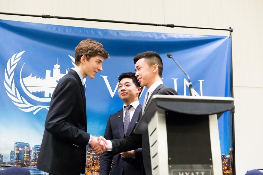 Jake Hauser shakes the hand of Spencer Louie after being announced as the Secretary-General of VMUN 2016