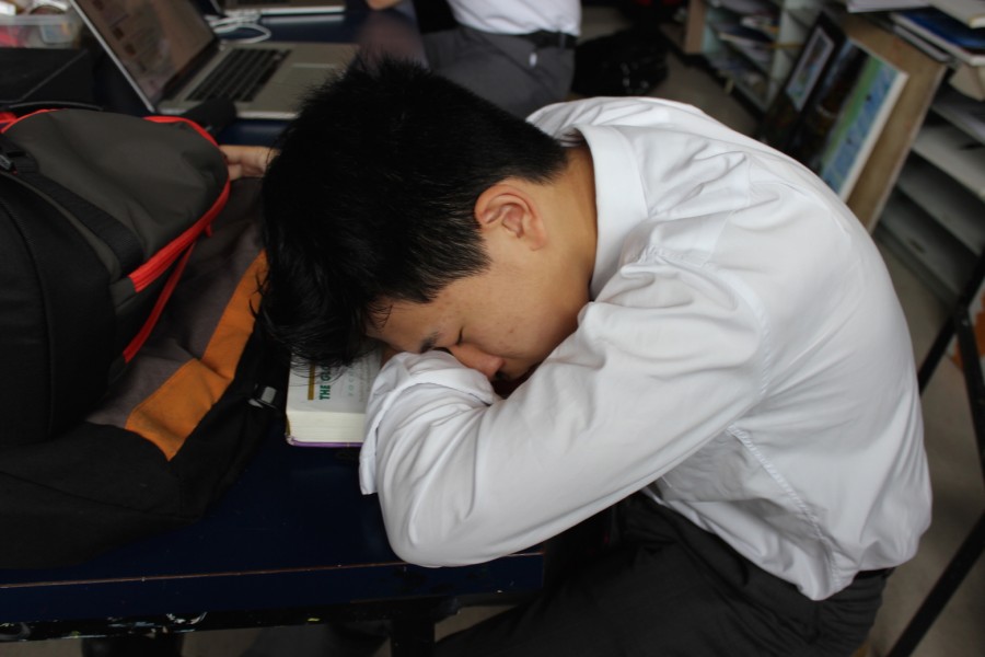 Alan Zha (Grade 11) taking a quick nap in the Art Room