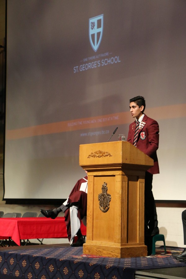 School Caption on his stool as he address to the school faculty and students. 