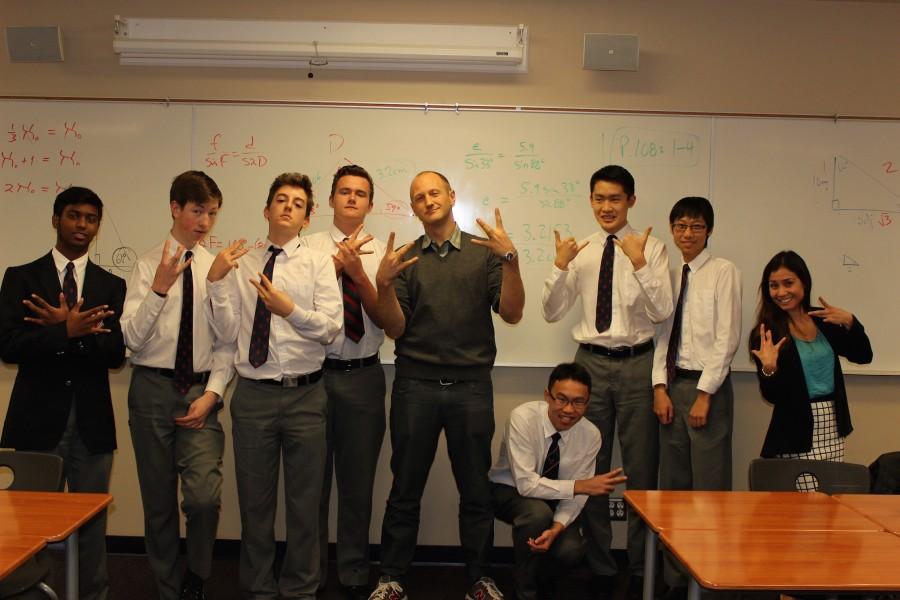 Baba Brinkman and some Saints students pose with west-side hand signs (Left to Right: Isaac Shaha, JD Edmonds, Devon Mussio, Dylan Enright, Baba Brinkman, Joshua Chang, Jack Zhang, Bill Lou, Ms. Sandra Gin).