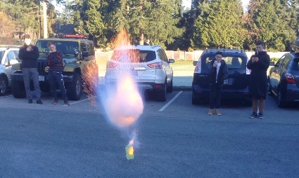 Grade 11 chemistry students watch an explosion from a pop bottle!