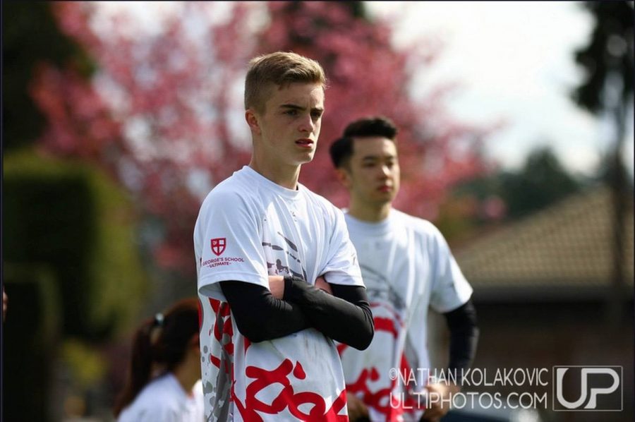 Owen and Rafy Siy (Grad 15) looking at the play on the field. 