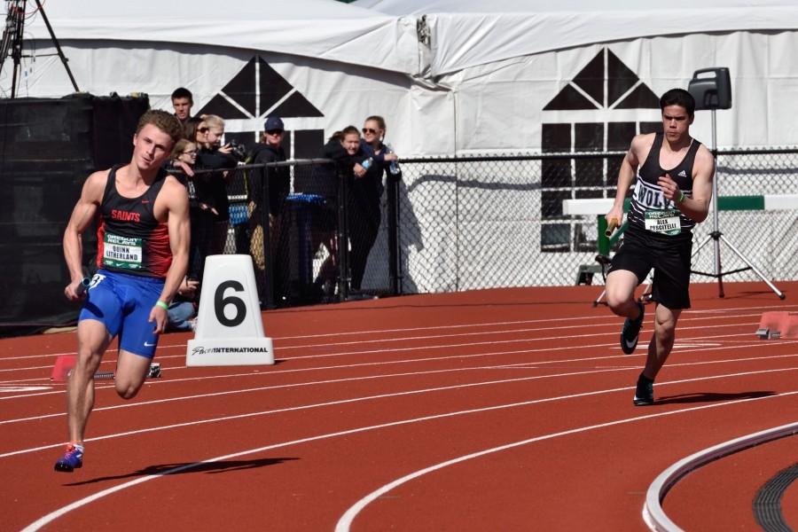 Quinn Litherland (Left) running in the Senior 200m