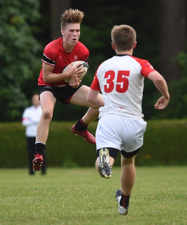 Will Sauder (12) catching a kick before juking his man 