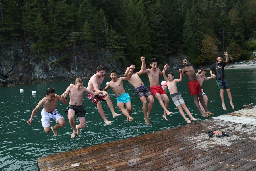 (From left to right) Roddy, Ben, James, Kevin, (Unidentified), Lucas, Benjamin, Shayne, Erik and Joshua jump off the dock together