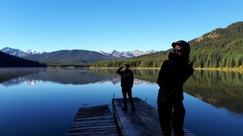 Henry Chan (back) and Phil Wu (front) pose in front of a scenic background during their hike of the South Chilcotin Mountains.