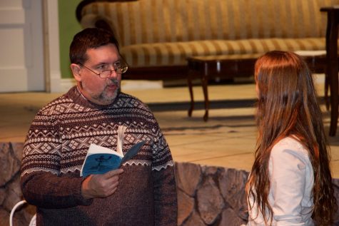 Mr. Fredeman, standing in for the role of Seth, and Cassidy Reichman, playing the role of Tracy, have a conversation on stage.

