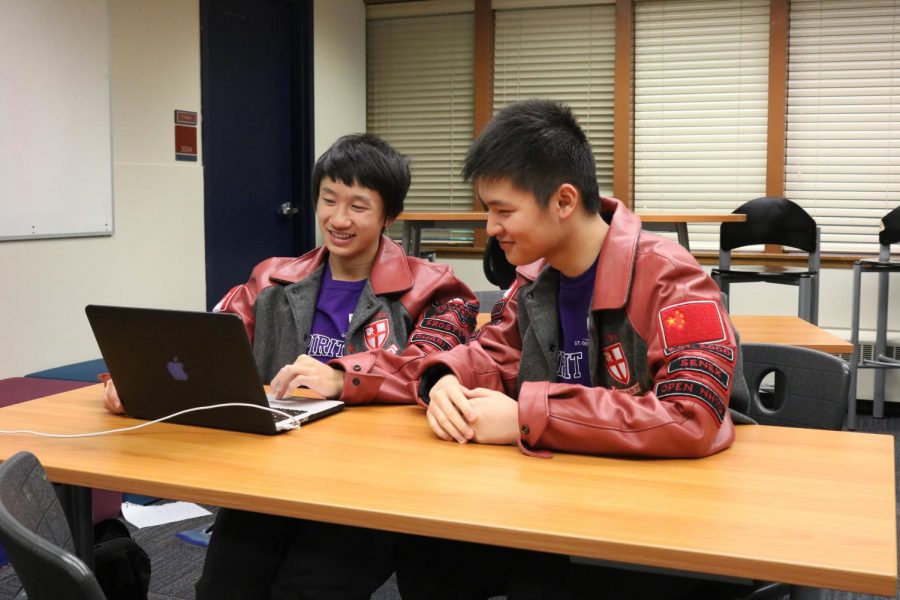Students Matt and Ken wearing purple shirts in class