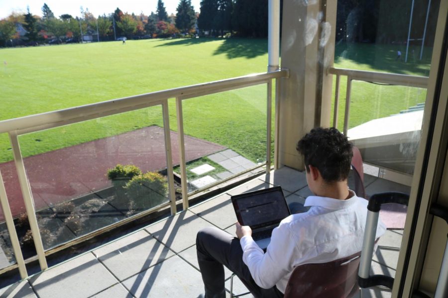 Jacob Pallai working hard on the patio of the grad lounge. 