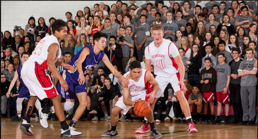 The packed crowd at last years Saints VC tilt looks on anxiously as Roberto Mazzone recovers a loose ball
