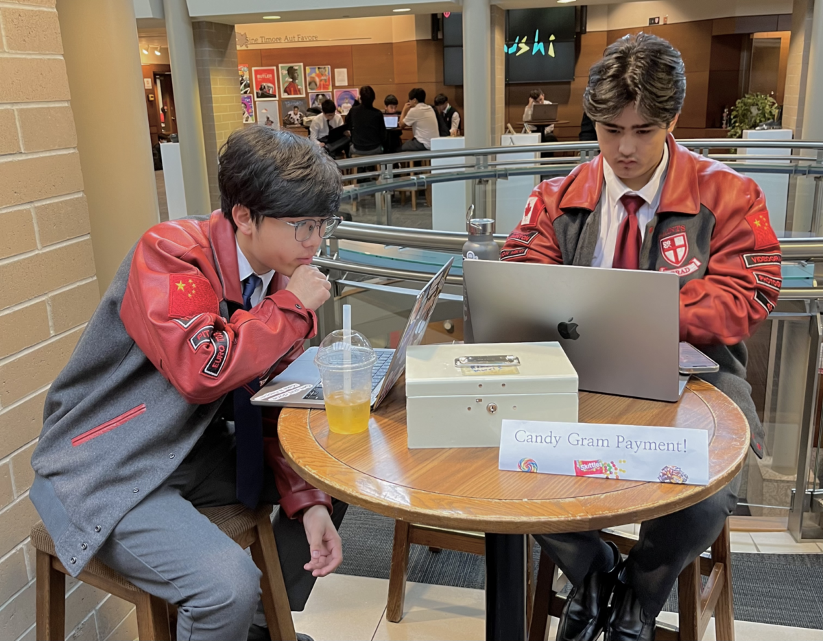 Chris Guo & Ian Crawford collecting Candy Gram payments in the Upper Grade Hall