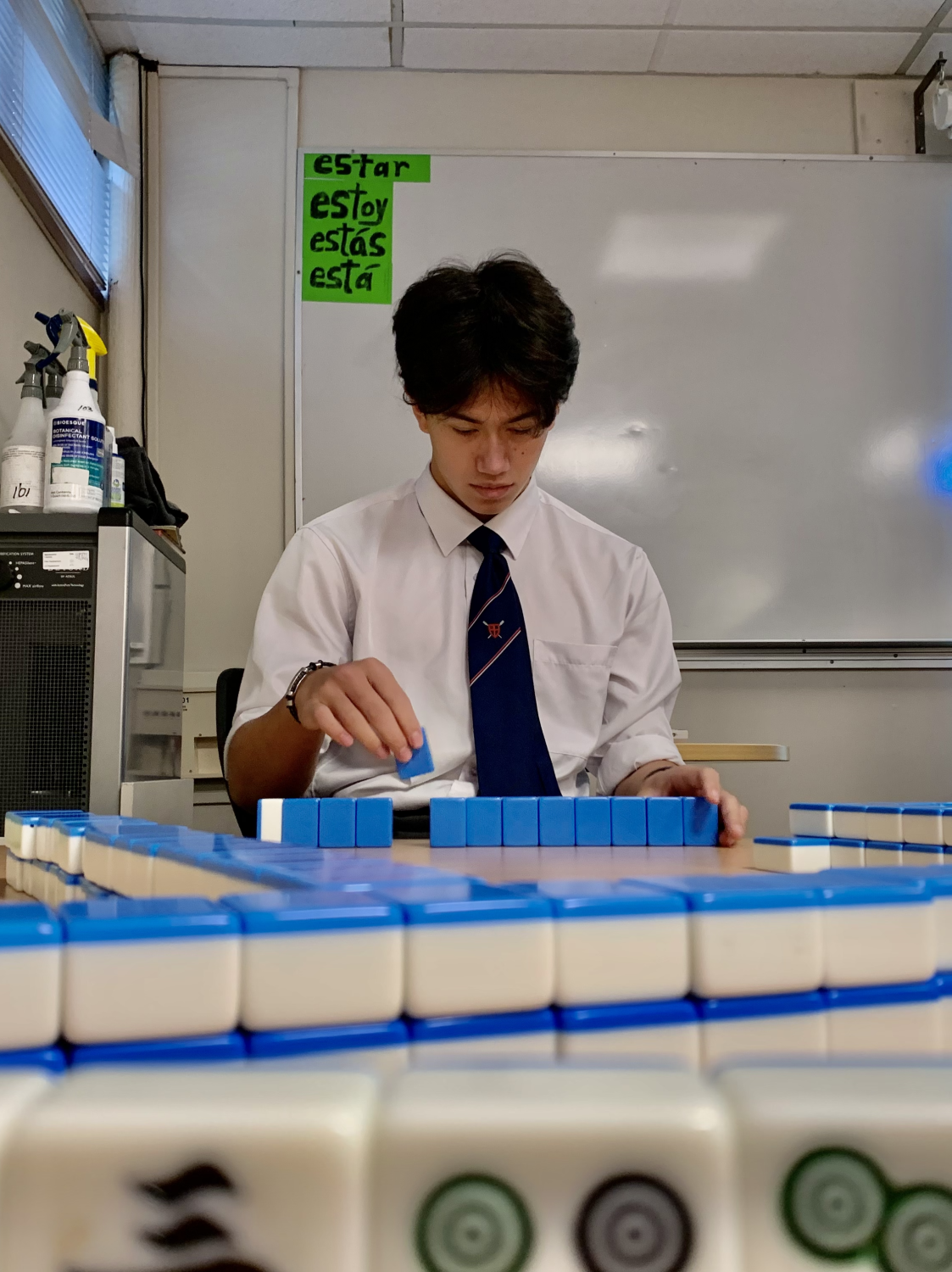 Garret Fuller (11) organizing his Mahjong tiles