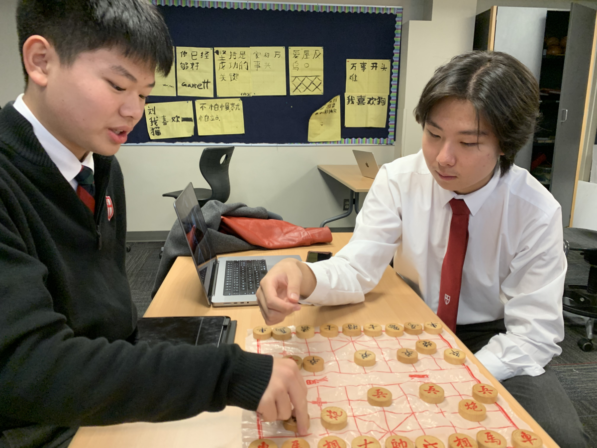 Students of the AP Chinese Language and Culture class Jimmy Sun (11) and Jason Li (12) learn how to play Xiangqi