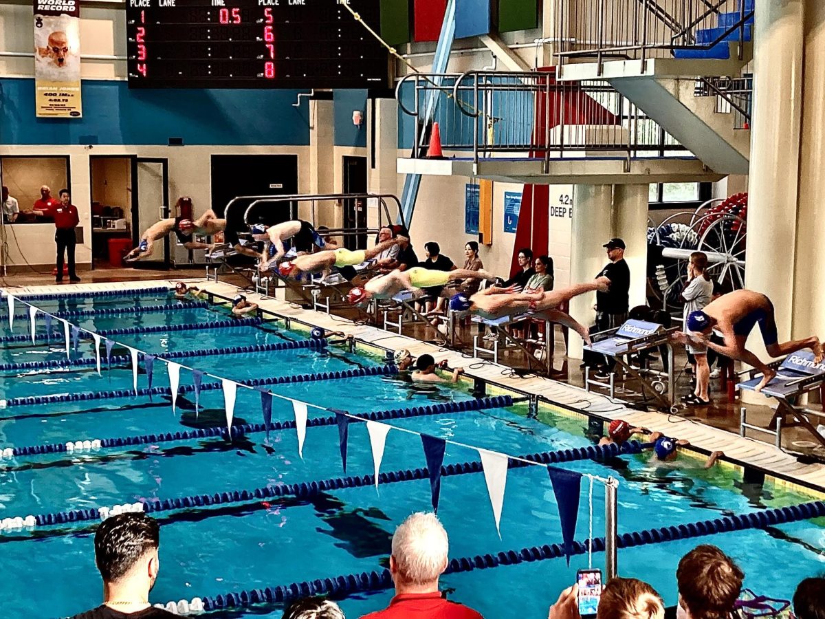 Joshua Ong ('27), Matthew Cao ('28), and Tyler Clogg ('28) compete in the Boys' 50-metre Freestyle.